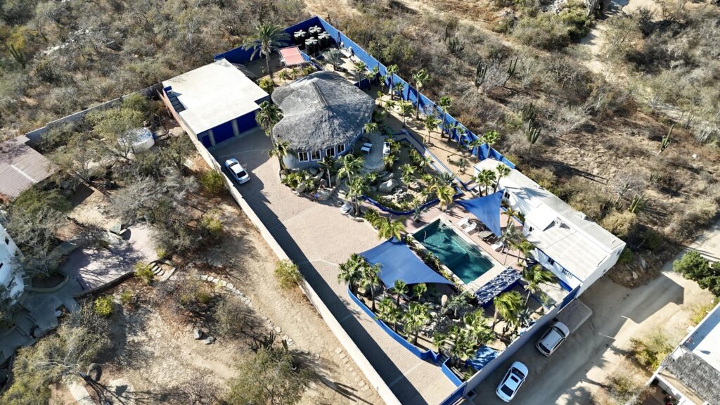 Los Cabos Brisas Del Pac East Rare opportunity to own a large Cabo property in a prime location close to the highway, shopping, hospitals, and schools. This unique compound offers multiple buildings with room for expansion and incredible rental income potential.The main home is an authentic Cabo-tyle house at the center of the property. A separate casita can easily be converted into two condos, ideal for generating rental income. The property also includes a large garage and workshop, with a flat buildable pad above the garage--perfect for another home or condos with stunning for sale