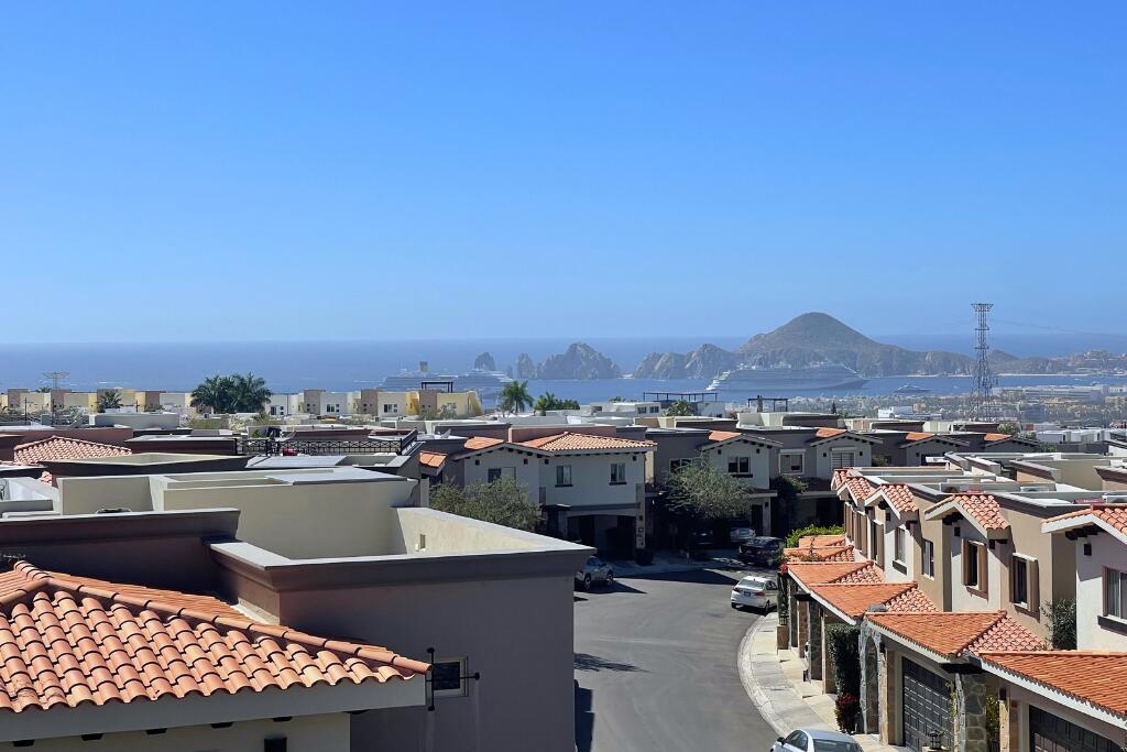 Los Cabos Cumbre Del Tezal Move-in ready and fully furnished. 2,045 sq ft of construction on a 2,551 sq ft lot with 3-car parking. Luxury finishes include marble flooring, wood kitchen with granite countertops, built-in wooden closets in all bedrooms, and vanities with tempered glass shower doors in all 3.5 baths. Fully equipped with 5 Gree inverter mini-split A/C units (3 × 1-ton, 2 × 2-ton), LG 22' French Door refrigerator, Whirlpool gas stove, and 1.7 cu ft microwave hood. Additional features: rooftop with bar, grill & sink, private terrace, storage, WiFi smart lock, private 5,000-liter cistern, and termite prevention system. ommunity: pool, gym, sports courts, kids' area, 3 clubhouses & 24/7 gated security for sale