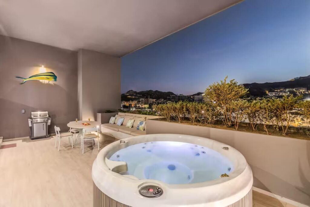 Los Cabos The Paraiso Residences Experience the best location and the luxury with Condo Marina Vista, located at The Paraiso Residences, this modern 2BR/2BA condo is just steps from the world famous Cabo San Lucas Marina, putting you in the heart of the action. Delight yourself with the impressive private terrace, with jacuzzi, grill and much more. With its new and modern taste, Condo Marina Vista is your best option for your second home or investment in Cabo. This condo features modern decor in perfectly lit spaces, fully equipped kitchen with everything you will need, including electric stove, dishwasher, oven, microwave, etc. A spacious and fun living room perfect for entertaining and relaxing, with a comfortable sofa that can make extra sleeping space for one more guest. Two large bedrooms with King size beds and bathroom with shower, both with ample wardrobe space, TV and luxury bedding. The living room is spacious and perfect for entertaining, with a comfortable sofa that can function as an additional sleeping space for one or two more children.Wait until you come out! First open the pocket doors from the living room to the master bedroom to extend your area to the outside terrace with jacuzzi, barbecue and dining for six. Enjoy the huge spacious terrace and its magnificent – Paraiso Residences, Cabo San Lucas, BS